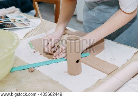Womens Hands Knead Clay, Drawing Elements Of The Product. Production Of Ceramic Products At The Mast