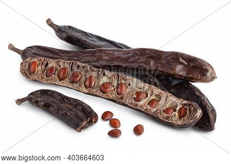 Ripe Carob Pods And Bean Isolated On White Background With Clipping Path And Full Depth Of Field