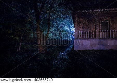 Mountain Night Landscape Of Building At Forest At Night With Moon Or Vintage Country House At Night