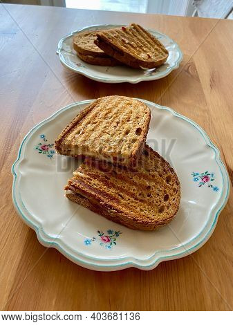 Homemade Turkish Toast (tost) With Melted Cheese In Traditional Plate On Wooden Table. Half Cut Slic