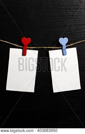 Photos Are Held With Heart-shaped Clothespins On A Rope. Copspace. Valentines Day.