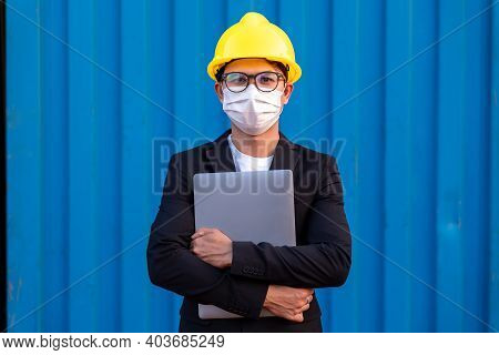 Portrait Of Asian Business Man Import And Export Goods Wear A Helmet Logitics Shipping Wear Masks Pr