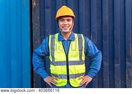 Portrait Of Asian Workers Import And Export Goods Wear A Helmet Logitics Shipping At Container Backg