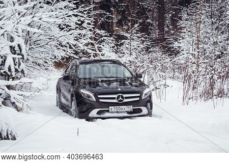 Moscow, Russia-january 10, 2021: A Black Mercedes Benz Gla 250 Luxury Crossover Makes Its Way Throug