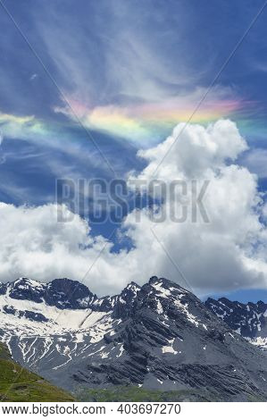 Iridescent Cloud Over The Road To Stelvio Pass, Sondrio Province, Lombardy, Italy, At Summer.