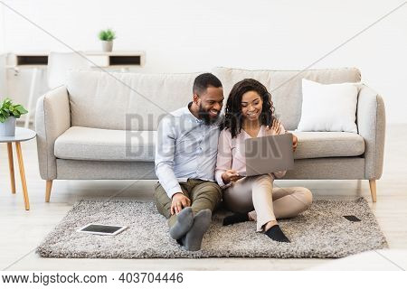 Virtual Communication. Happy Black Couple Having Online Video Conference With Friends Or Family Usin