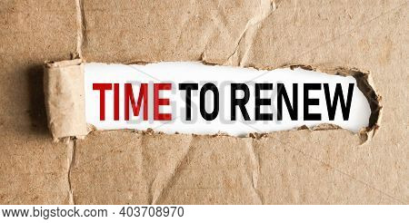 Time To Renew, Text On White Paper On Torn Paper Background