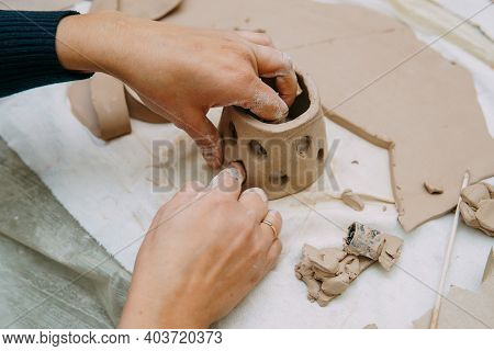 Women's Hands Knead Clay, Drawing Elements Of The Product. Production Of Ceramic Products At The Mas