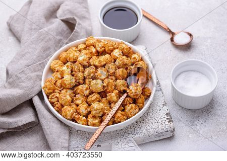 Salted Caramel Popcorn In Bowl On Light Background
