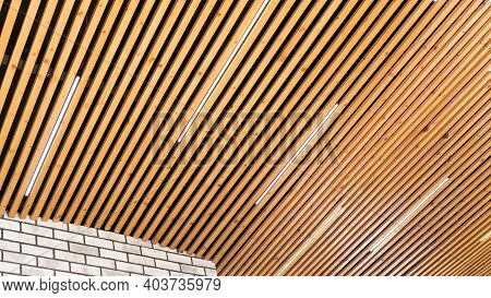 Loft Style Wooden Plank Ceiling Design Idea. Slatted Wooden Ceiling In The Interior. Designer Ceilin