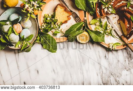 Easter Holiday Dinner Table Setting. Flat-lay Of Easter Eggs, Lemon Cake With Citrus Tree Blossom Br