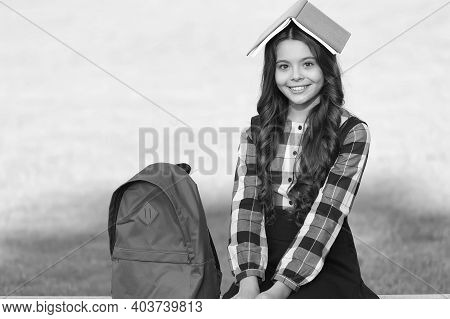 Feeding Your Brain With Reading. Happy Child Hold Book On Head. Reading Education. Book Learning. Sc