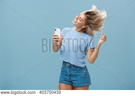 Girl Enjoying Cool Bits In Brand New Wireless Earphones Advertising Earbuds In Own Blog Recodring Vi