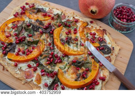 Tarte Flambee With Pumpkin, Cheese, Kale And Pomegranate