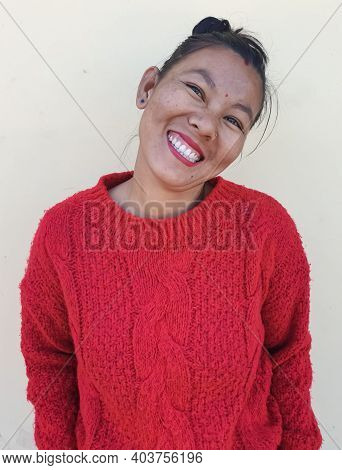 Closeup Of A Beautiful Asian Girl With Pretty Smile Posing, Selective Focus Of A Girl With Red Sweat