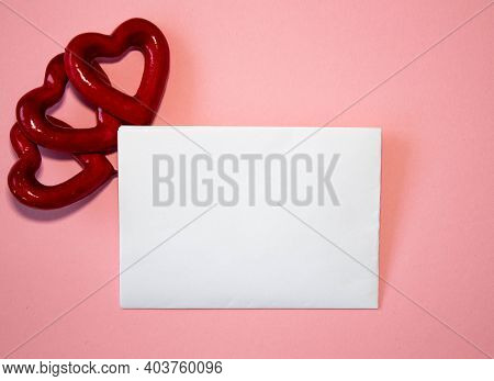 Valentines Day Congratulation. Red Rose And Greeting Card With Heart Sign On Black Background Top Vi