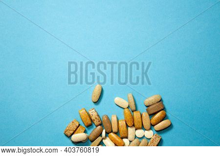 Lot Of White Capsules As Medical Background. Top View. Style.