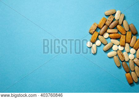 Lot Of White Capsules As Medical Background. Top View. Style.
