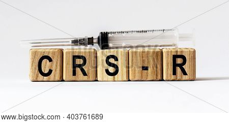 Text Crs-r Made From Wooden Cubes. White Background