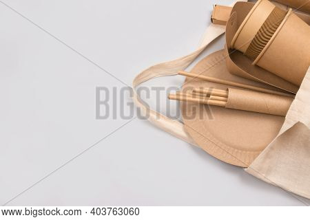 Eco-friendly Tableware - Kraft Paper Food Cups And Containers In Cotton Bag On Gray Background With 