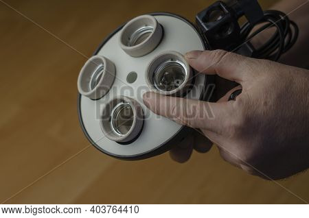 Man's Hand Holds New 4-lamp Holder. Softbox Holder, Photo Equipment, Continuous Lighting.