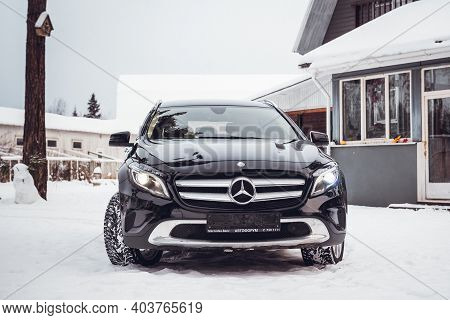 MOSCOW, RUSSIA-JANUARY 10, 2021: Black luxury crossover Mercedes Benz GLA 250 on a suburban plot in