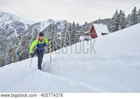 Young Man In Action On Climbing Touring Skis