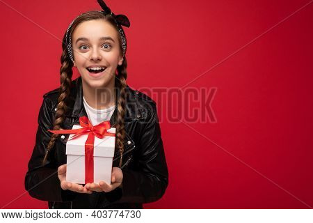 Photo Of Beautiful Happy Brunette Girl Isolated Over Red Background Wall Wearing White Casual T-shir