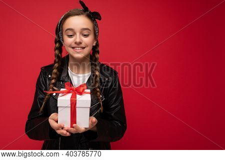 Shot Of Beautiful Happy Smiling Brunette Female Kid Isolated Over Red Background Wall Wearing White 