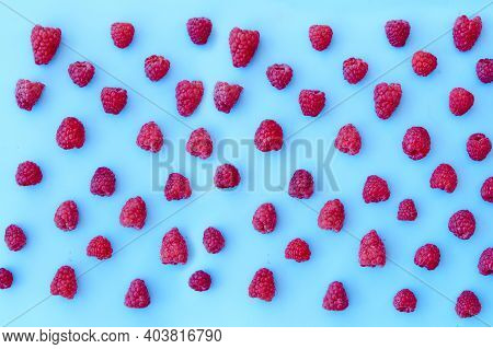 Raspberry Pattern, Blue Background, Top View\rpattern Of Ripe Red Raspberry On Blue Background. Vega