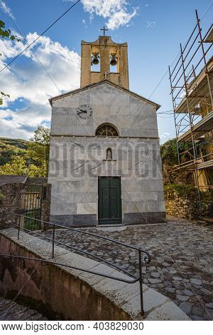 View Of The Church Facade In One Of Empty Stone Streets Of An Abandoned Mountain Village With A Few
