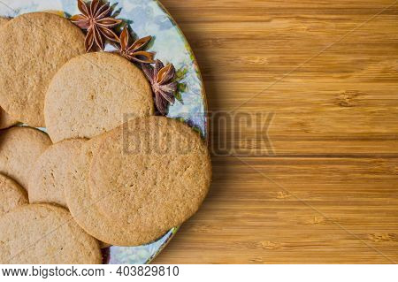 Round Gingerbread Cookies On Wooden Background With Blank Space