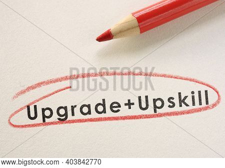Upgrade And Upskill Text Circled In Red Pencil -- Job Training Concept