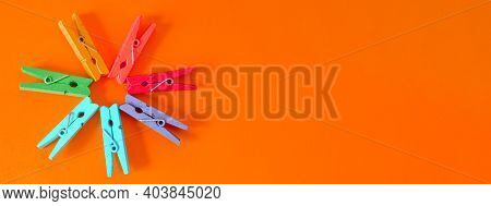 Banner Concept Of Mood-boosting Color, Multi-colored Wooden Multi-colored Clothespins In The Shape O