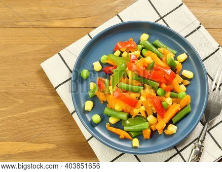 Vegetable Salad Of Carrots, Corn And Beans On A Saucer, Close-up.