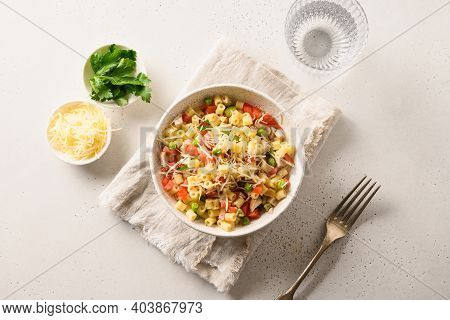 Italian Salad With Ditalini Pasta, Tomatoes, Sausage On White Table. View From Above.