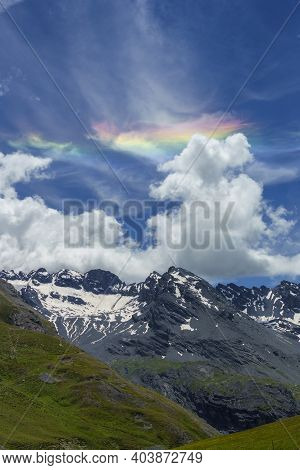 Iridescent Cloud Over The Road To Stelvio Pass, Sondrio Province, Lombardy, Italy, At Summer.