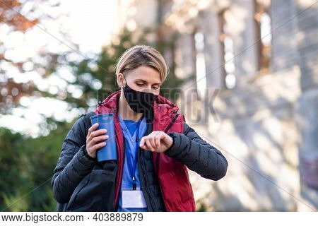 Woman Caregiver, Nurse Or Healthcare Worker Outdoors On The Way To Work, Coronavirus Concept.