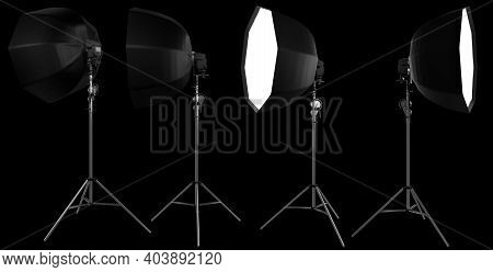 Studio Lighting Stands With Flash And Octobox Isolated On The Black Background With Clipping Path. 3