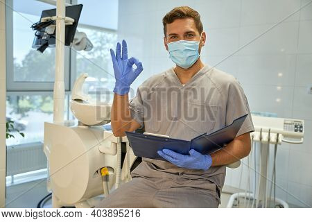Joyful Worker Of Dental Clinic Practising Positive Atittude