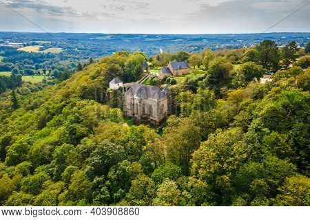 Aerial view of the old Sainte Barbe chapel lost in the forest, Morbihan, Bretagne, France