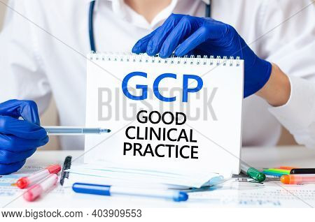 Doctor Holding A Card With Text Gcp - Short For Good Clinical Practice, Medical Concept. The Text Is