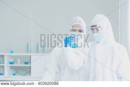 Two Asian Scientist Team Reserch Chemistry Science Tube Experiment Biotech Antibody Sample In Labora