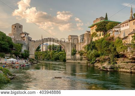 Mostar, BiH - August 30, 2019: Stari Most bridge at sunset in old town of Mostar, Bosnia and Herzegovina. Mostar cityscape at summer