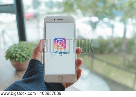 Chiang Mai, Thailand - Sep. 20,2020: Man Holding Iphone With Instagram Application On The Screen. In