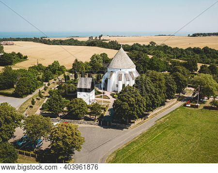 Bornholm, Denmark - August 09, 2020: Aerial Drone View Of Famous Osterlars Church.