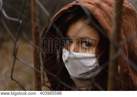 Young Girl Wears Mask That Protects Againts The Spread Of New Coronavirus Covid-19 Disease