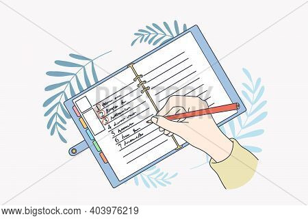 Motivation And Aiming For New Life Concept. Human Hands Making List Of Resolutions For Starting New 
