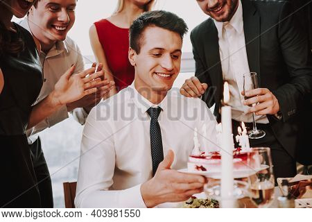 Man Is Proposing To Woman With Engagement Ring Near Window. A Man Puts A Ring On A Woman Who Has Bee