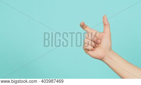 Empty Hand Holding Or Catch Nothing Guesture On Green And Blue Or Mint Background.